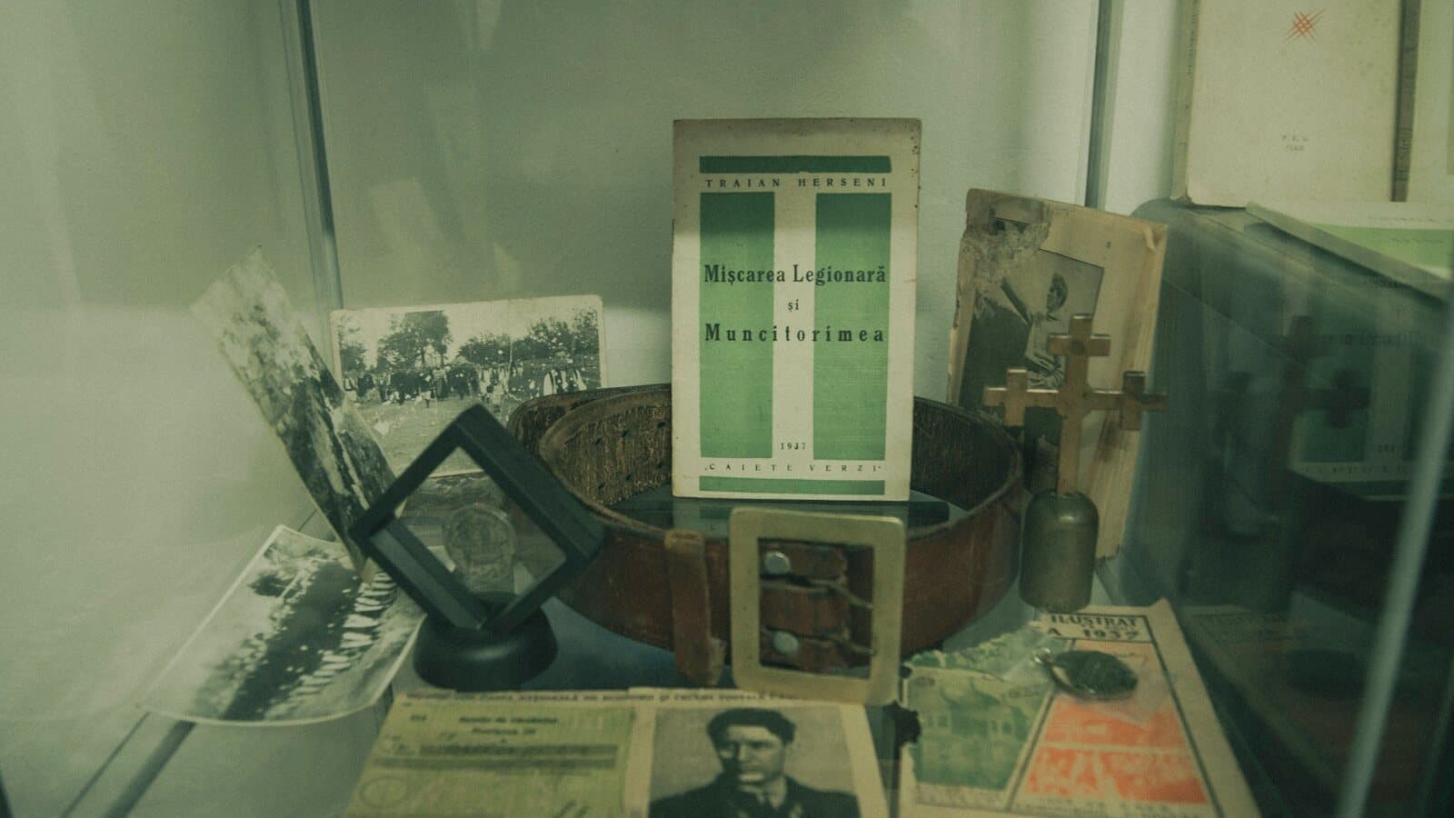 Glass museum case holding historic photos, documents, and small artifacts - representative of the Port Aransas Museum island-history exhibits.