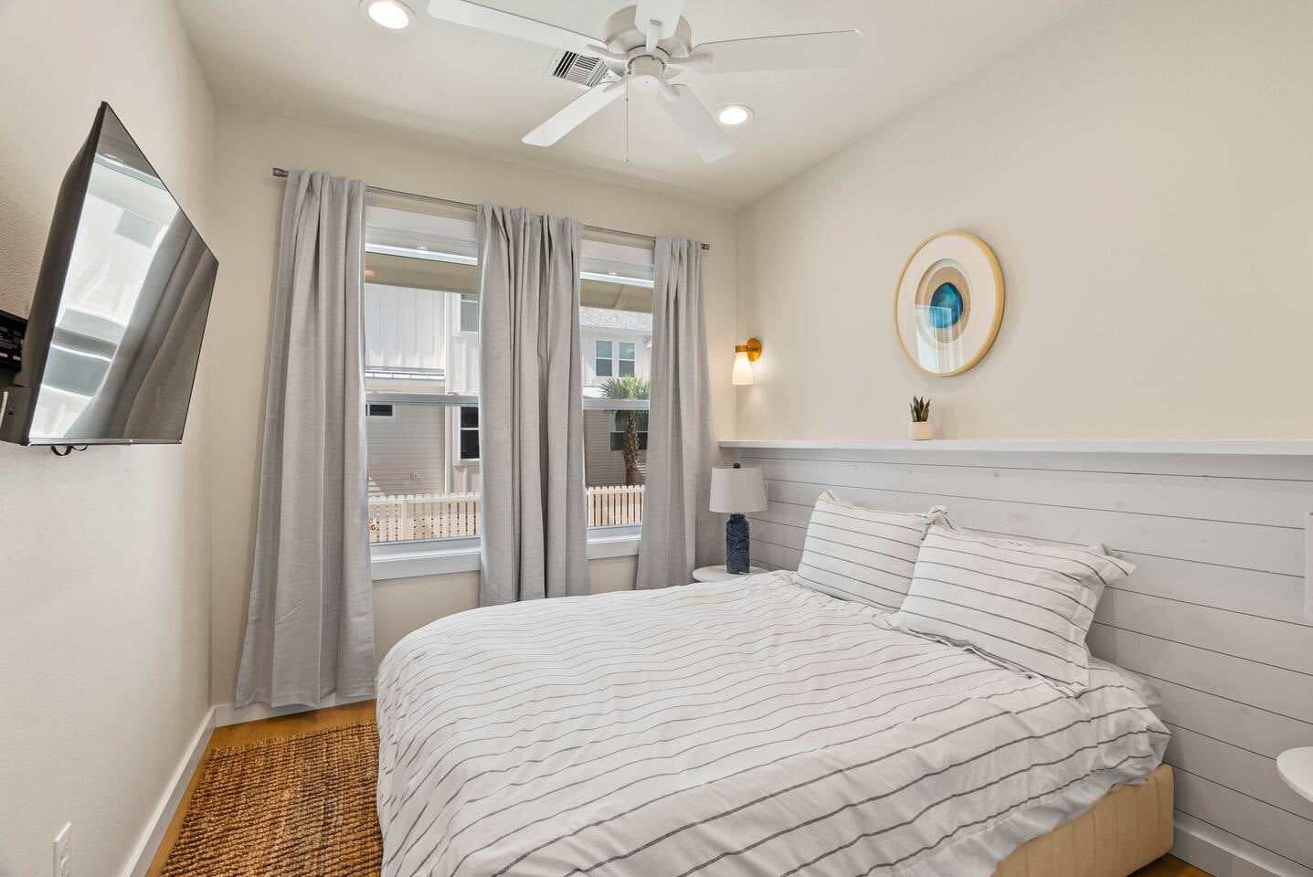 First-floor bedroom with a view of the pool, perfect for guests who prefer easy access and privacy. This room has its own bathroom with shower conveniently located nearby in the hallway.